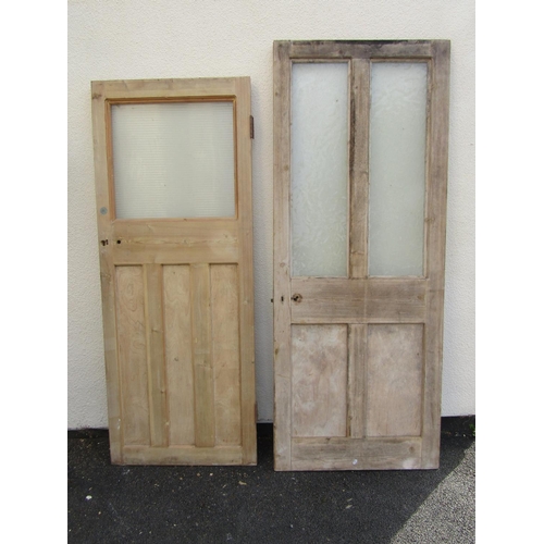 2517 - Five various stripped pine and panelled doors, two partially glazed