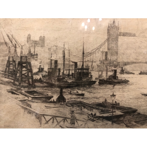 114 - Two framed engravings and etchings to include: Stanley Charles Rowles (20th century) - 'Tower Bridge... 