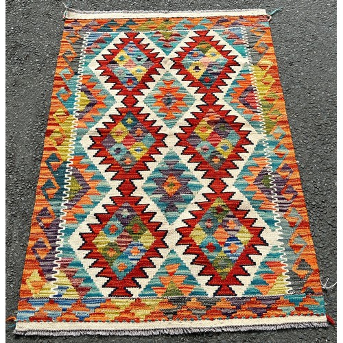 2739 - A Chobi Kilim with two diamonds flanked by stepped medallion, 124 x 82cm approx together with A Chob... 