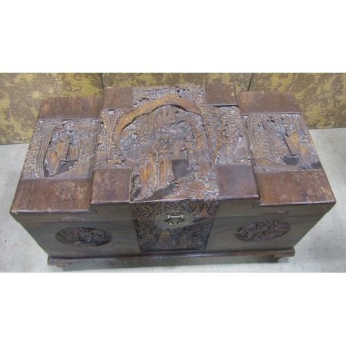 2146 - A Chinese camphor wood coffer with deeply carved landscape and character detail