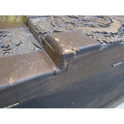 2146 - A Chinese camphor wood coffer with deeply carved landscape and character detail