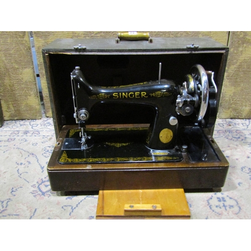 2125 - A vintage portable Singer sewing machine with simulated crocodile skin case