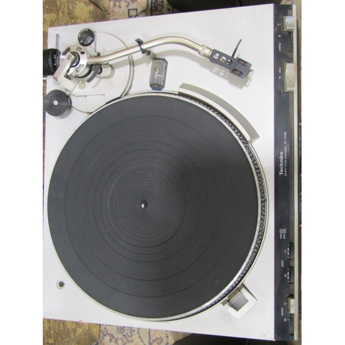 2130 - A Technics direct drive automatic turntable model SL-3200, together with a later Technics Stereo cas... 