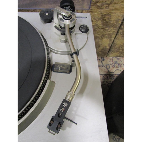 2130 - A Technics direct drive automatic turntable model SL-3200, together with a later Technics Stereo cas... 