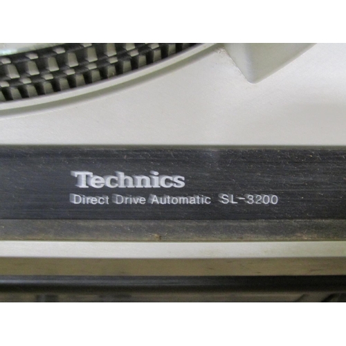 2130 - A Technics direct drive automatic turntable model SL-3200, together with a later Technics Stereo cas... 