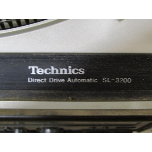 2130 - A Technics direct drive automatic turntable model SL-3200, together with a later Technics Stereo cas... 