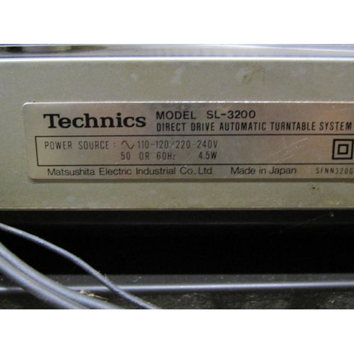 2130 - A Technics direct drive automatic turntable model SL-3200, together with a later Technics Stereo cas... 