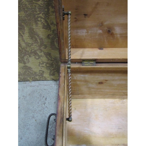 2149 - An old stained pine box with hinged lid and iron work drop side carrying handles 81 cm long x 54 cm ... 