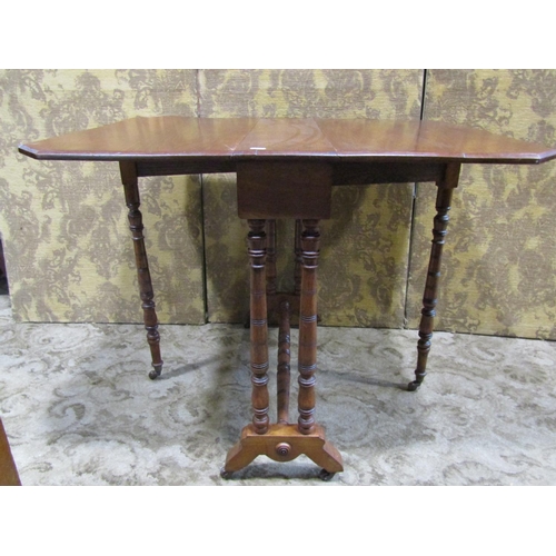 2166 - A Victorian mahogany drop leaf Sutherland tea table raised on turned supports and castors, (af), tog... 