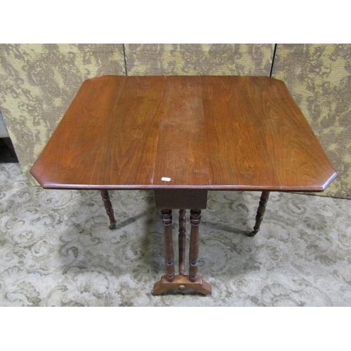 2166 - A Victorian mahogany drop leaf Sutherland tea table raised on turned supports and castors, (af), tog... 