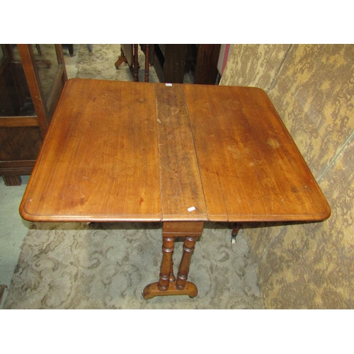 2166 - A Victorian mahogany drop leaf Sutherland tea table raised on turned supports and castors, (af), tog... 