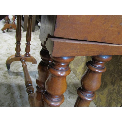 2166 - A Victorian mahogany drop leaf Sutherland tea table raised on turned supports and castors, (af), tog... 