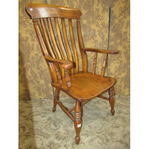 2171 - An antique Windsor stained elm and beechwood lathe back elbow chair with saddle shaped seat