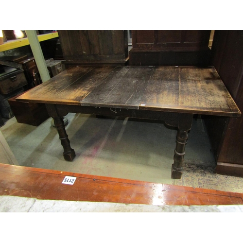 2226 - An oak kitchen table marked Liberty raised on four turned supports, 127 x 103 cm to seat six