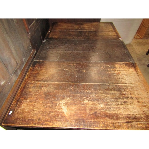 2226 - An oak kitchen table marked Liberty raised on four turned supports, 127 x 103 cm to seat six