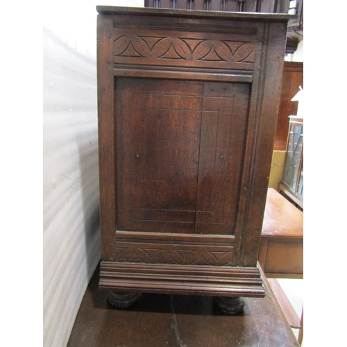 2232 - Antique oak side cupboard enclosed by two doors with additional carved panel work including lamb and... 