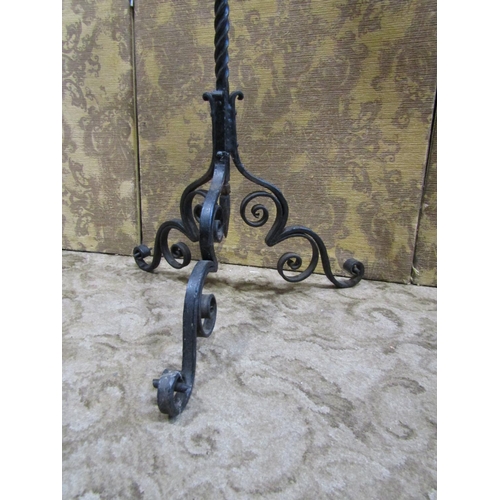 2241 - A good quality heavy wrought iron three branch ecclesiastical pricket candle stand, on tripod base