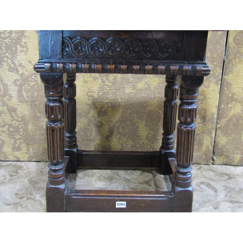 2263 - A 19th century carved oak stool of rectangular form raised on four splay supports with carved and fl... 