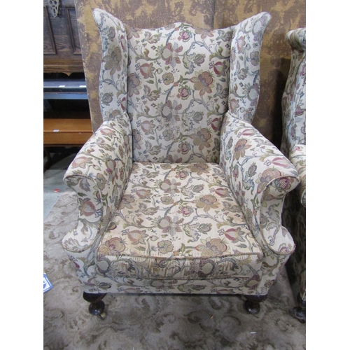 2310 - A near pair of Georgian style wing chairs with Tudor style tapestry upholstery