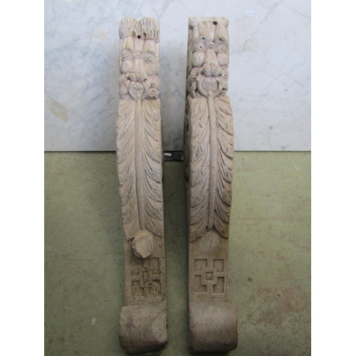 2370 - A pair of 19th century limed hardwood brackets with lion mask acanthus and other detail, supporting ... 