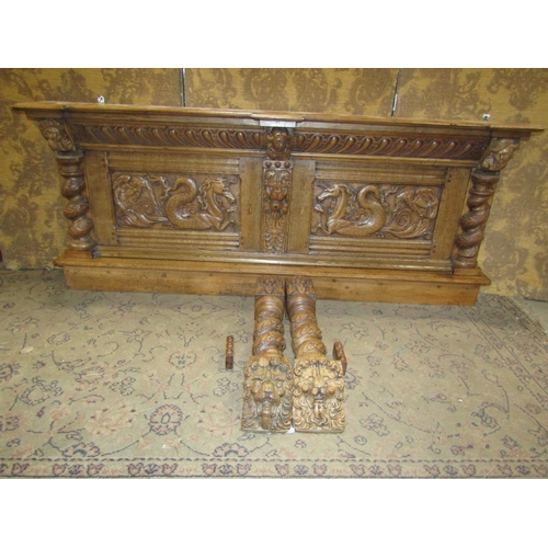 2373 - An old English oak overmantle with spiral column supports with lion mask and other detail, the main ... 