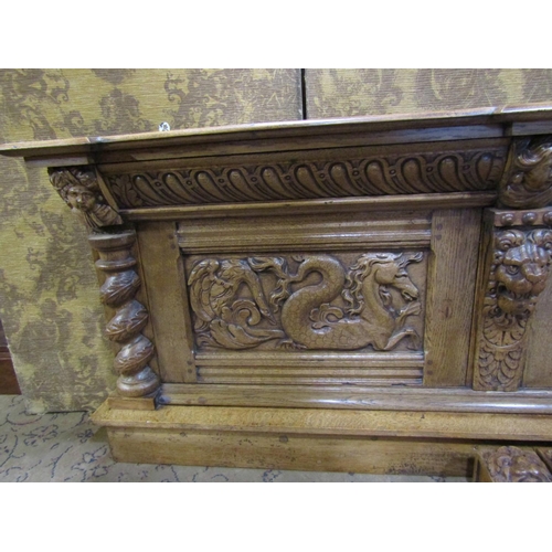 2373 - An old English oak overmantle with spiral column supports with lion mask and other detail, the main ... 