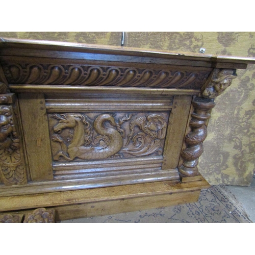 2373 - An old English oak overmantle with spiral column supports with lion mask and other detail, the main ... 