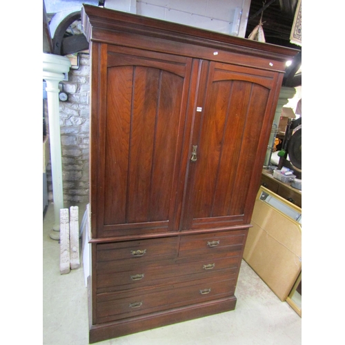 2374 - A Victorian walnut linen press from Maple & Co, the lower section enclosed by two long and two short... 