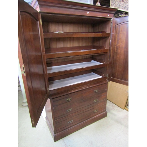 2374 - A Victorian walnut linen press from Maple & Co, the lower section enclosed by two long and two short... 