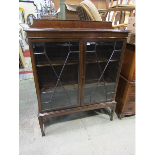 2377 - An Edwardian mahogany display cabinet on stand with astragal glazed panelled doors, raised on square... 