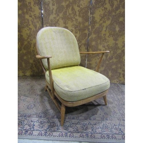 2379A - An Ercol Windsor stickback drawing room chair with turned supports