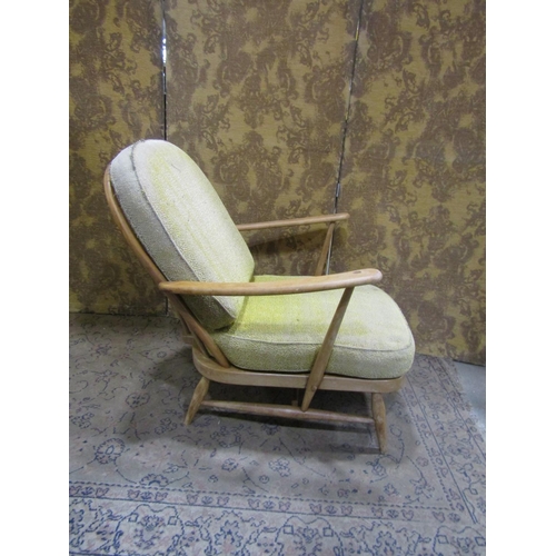 2379A - An Ercol Windsor stickback drawing room chair with turned supports