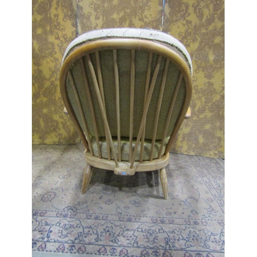 2379A - An Ercol Windsor stickback drawing room chair with turned supports