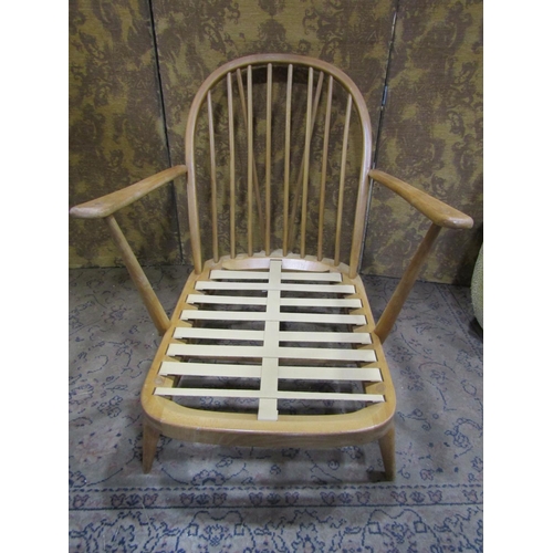 2379A - An Ercol Windsor stickback drawing room chair with turned supports