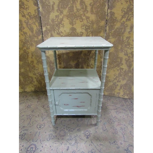 2380 - A Regency side table with faux bamboo supports, the lower section enclosed by a panelled door, 52cm ... 