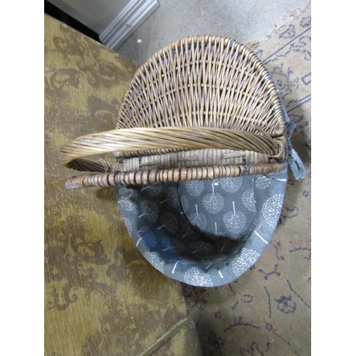 2386 - Four vintage style wicker baskets all with enclosed and hinged covers and loop handles