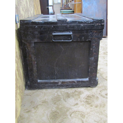 2148 - A vintage stained tin  lined chest with hinged lid and re-enforced overlaid steel fittings, 84 cm lo... 