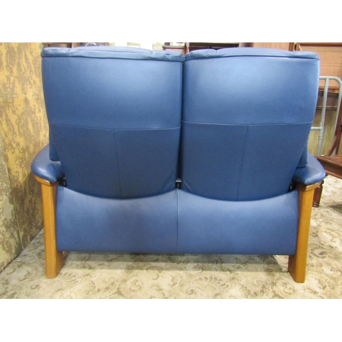 2163 - A Stressless Windsor high back two seat sofa in Paloma Oxford blue leather and beechwood together wi... 