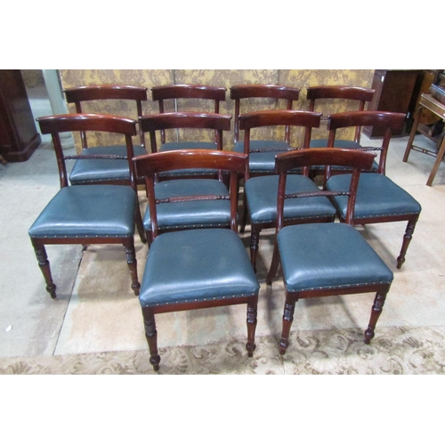 2168 - A set of ten Regency style mahogany curved bar back dining chairs with rope twist rails and upholste... 