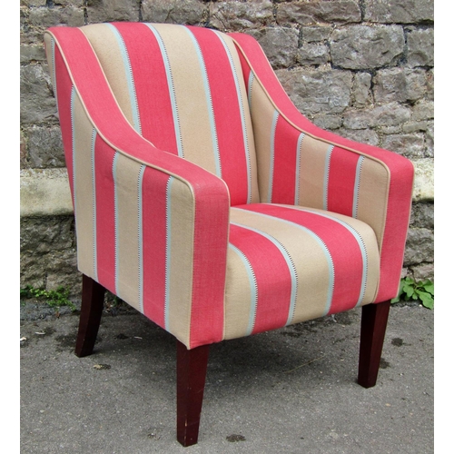 2317 - An upholstered easy chair in cream and pink striped material raised on square cut supports