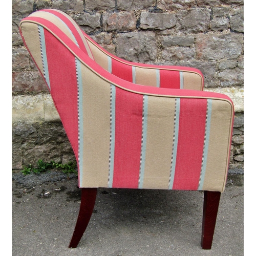 2317 - An upholstered easy chair in cream and pink striped material raised on square cut supports