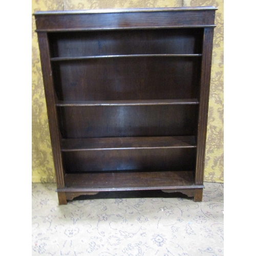 2308 - A simple open oak bookcase with three adjustable shelves 90 cm wide, together with one other (2)