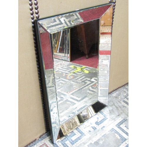 2408 - A contemporary wall mirror with bevelled edge plate within a further mirrored frame 80cm x 54cm