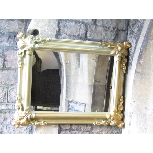 2415 - A rectangular wall mirror with flamboyant moulded frame and painted finish, 70 x 95cm