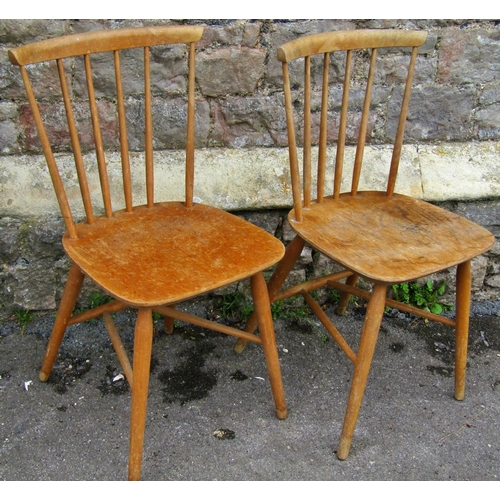 2379 - A pair of Ercol stick back kitchen chairs on turned supports together with a pine hanging wall shelf... 