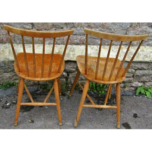 2379 - A pair of Ercol stick back kitchen chairs on turned supports together with a pine hanging wall shelf... 