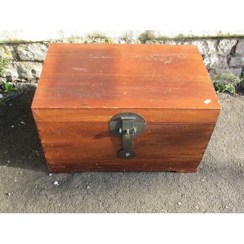 2439 - A contemporary hardwood chest with hinged lid plus contents including two carved hardwood figures, c... 