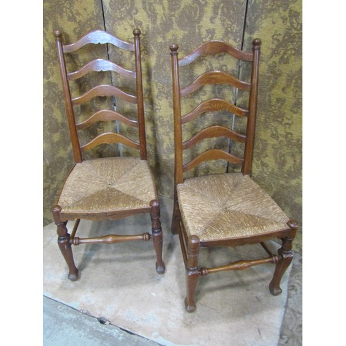 2176 - A Regency stained beechwood curved bar back lightweight open elbow chair with scrolled arms over a c... 