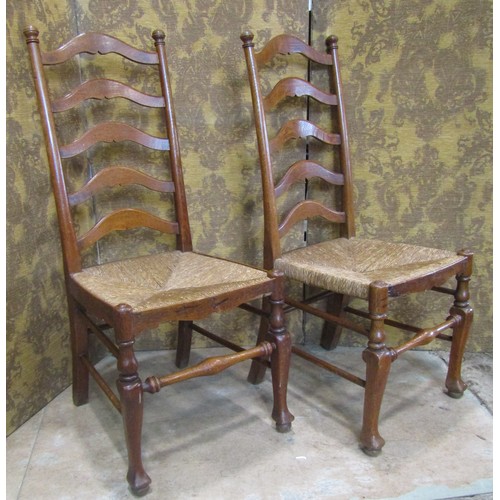 2176 - A Regency stained beechwood curved bar back lightweight open elbow chair with scrolled arms over a c... 