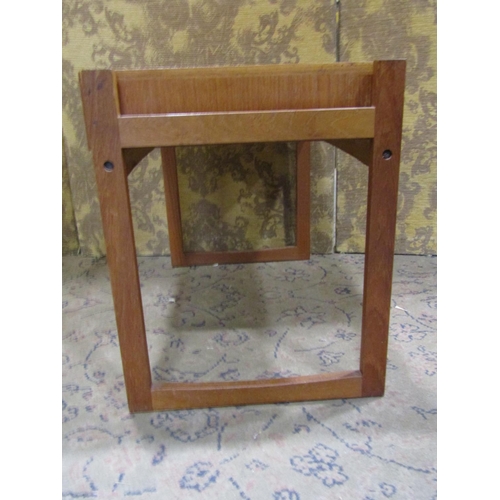 2202 - A low teak rectangular occasional table with frieze drawer raised on an open framework/supports, 62 ... 